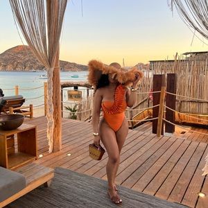 Andrea Iyamah orange bathing suit